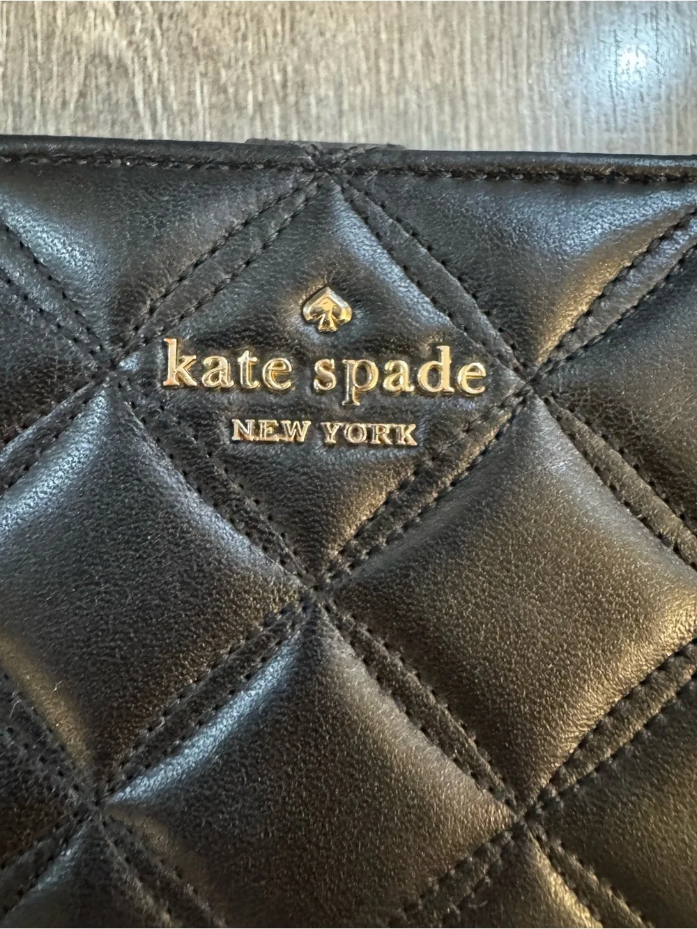 kate spade Black Quilted Leather Wallet with Gold Logo